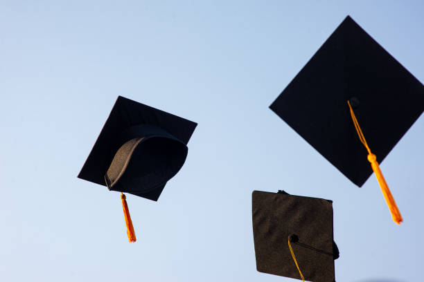 istock Throw a black hat of graduates in the sky. 1150604958