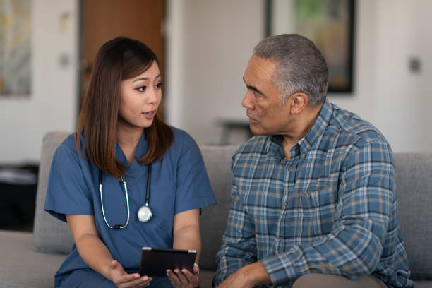 istock Young doctor with elderly patient 1150608038