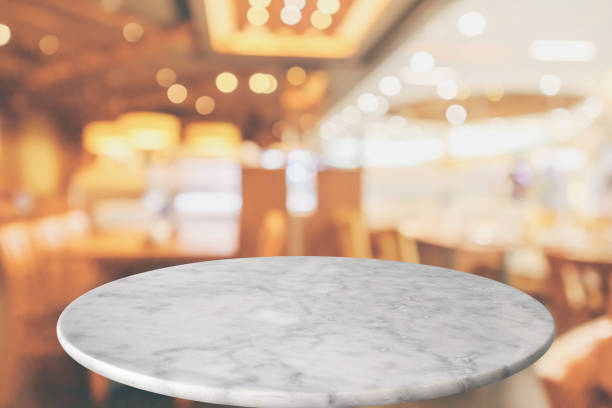 istock round marble table top with cafe restaurant bokeh lights abstract background for montage product display 1150608784