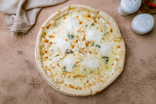 istock Pizza Quattro formaggi on white plate 1150609150