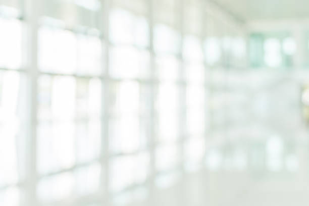 istock Office building blur background business lobby reception hall interior or empty indoor foyer meeting room with blurry light from glass wall window 1150610052