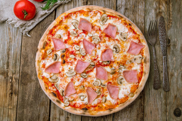 istock Pizza with ham and mushrooms 1150610218