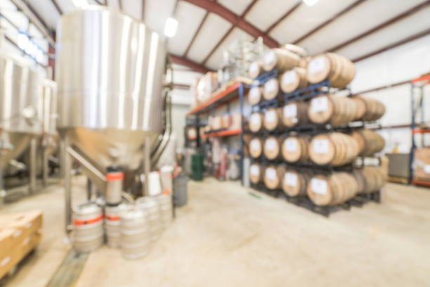 istock Blurry background stack of barrels in cellar at American brewery 1150613730