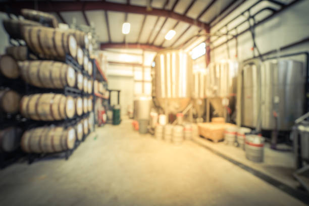 istock Blurry background stack of barrels in cellar at American brewery 1150613732