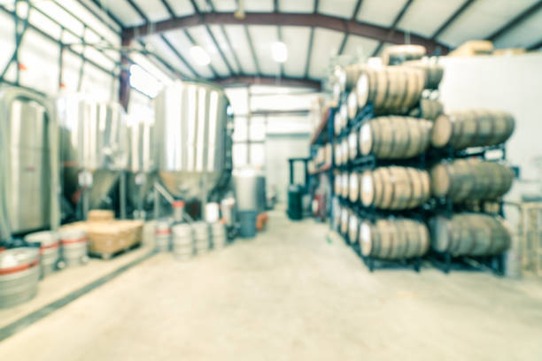 istock Blurry background stack of barrels in cellar at American brewery 1150613735