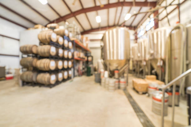 istock Blurry background stack of barrels in cellar at American brewery 1150613740