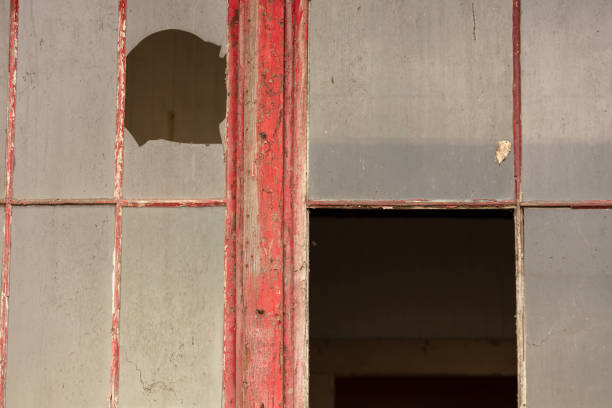 istock Old abandoned building falling apart with broken windows and doors 1150614633