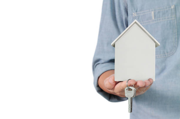 istock Mortgage concept by house from hand 1150619870
