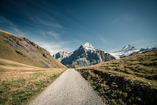 Grindelwald-First Hiking road with Swiss Alps mountain peaks.