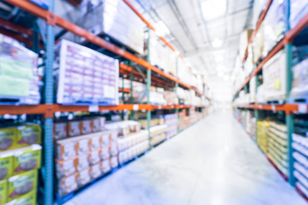 istock Filtered image blurry background big boxes wholesale store in America 1150628489