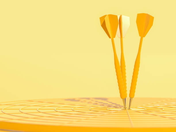 istock Darts hitting in the target center yellow color with copy space 1150630305