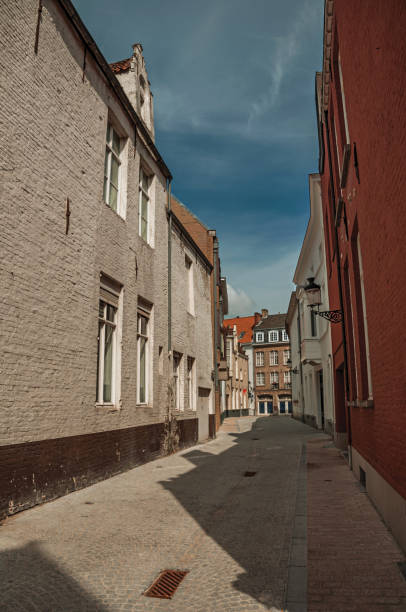 istock Quiet empty street with brick buildings at Bruges 1150631105