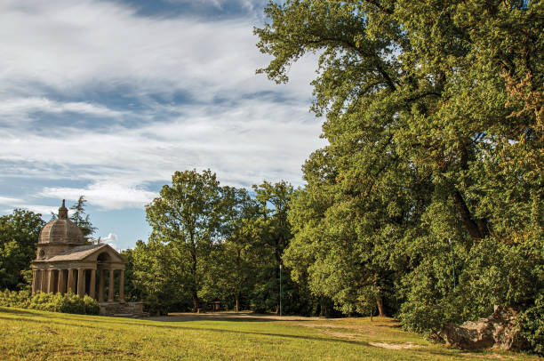 istock Small temple at sunset amidst the vegetation in Bomarzo 1150632626