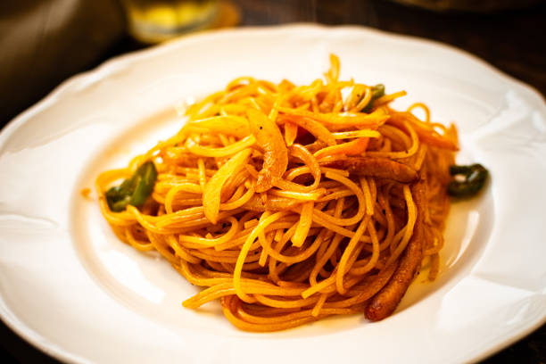 This dish is a spaghetti recipe that is seasoned mainly with ketchup, and contains sausage, peppers and onions.  This ketchup flavored pasta is popular and widely available at cafes and restaurants in Japan.