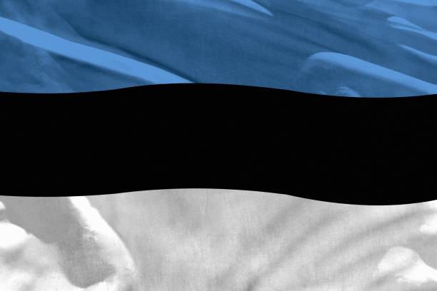 istock Waving Estonia flag for using as texture or background, the flag is fluttering on the wind 1150632950