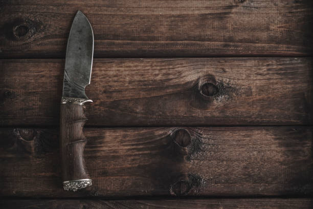 istock knife on wooden background 1150637637