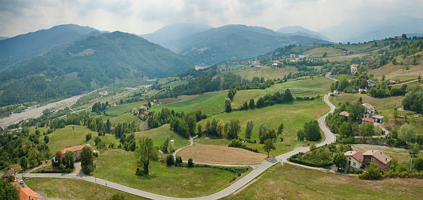 RoadValley A sweet road climbs the hill parma italy stock pictures, royalty-free photos & images