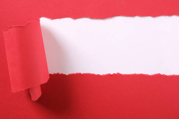 istock Torn red paper strip ripped edge frame white background 1150643724