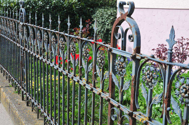 istock old rusty fence at village garden 1150646568
