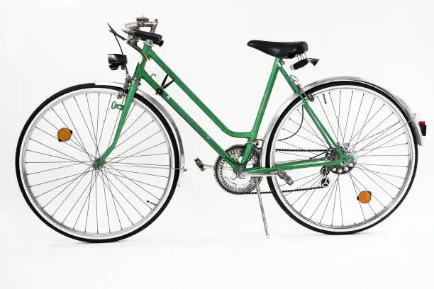 Photo of Old retro green vintage bicycle.
