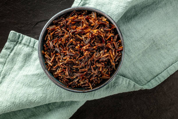 istock Wild black rice, shot from above on a dark background with copy space 1150647685