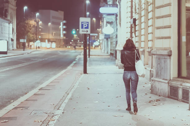 istock Lonely woman on a street 1150648898