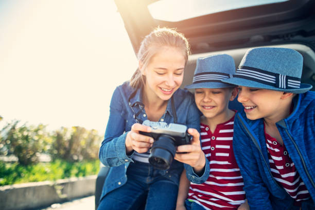 istock Kids enjoying road trip on sunny day 1150650606