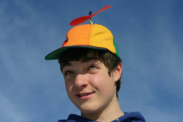 boy in propeller hat stock photo