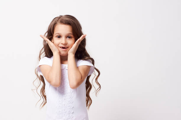 istock Wonder. Beautiful little girl. White background 1150652166