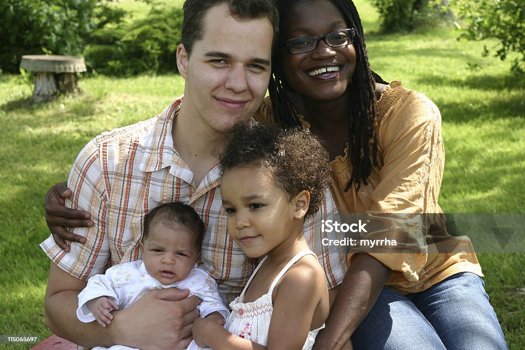 Beautiful Mixed Race Family adorable toddler with baby sibling Jamaica Stock Photo