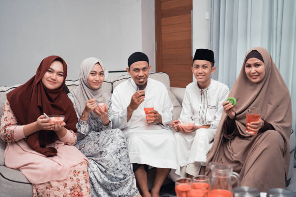 istock happy muslim having dinner at home break fasting on ramadan 1150657779