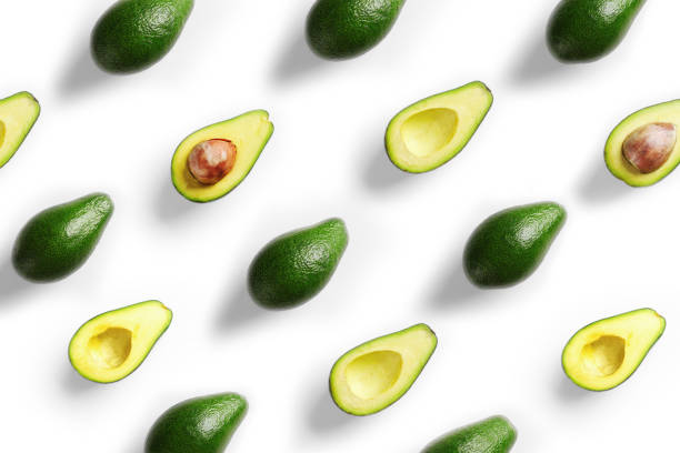 istock Plenty of fresh avocados on white background 1150659675