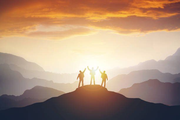 istock Silhouette of the team on the mountain 1150660042
