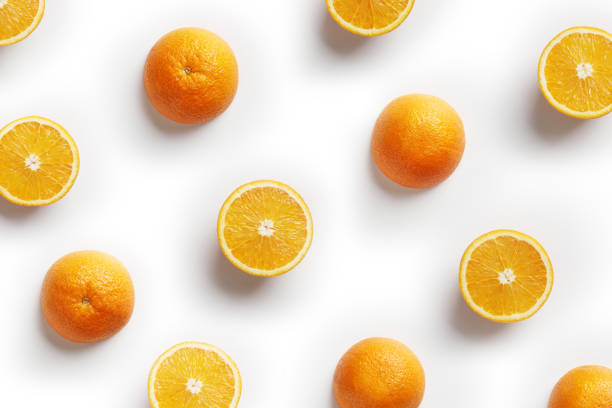 istock Fruit pattern of fresh orange slices on white background. Copy Space. Pop art design, creative summer concept. Top view 1150660102