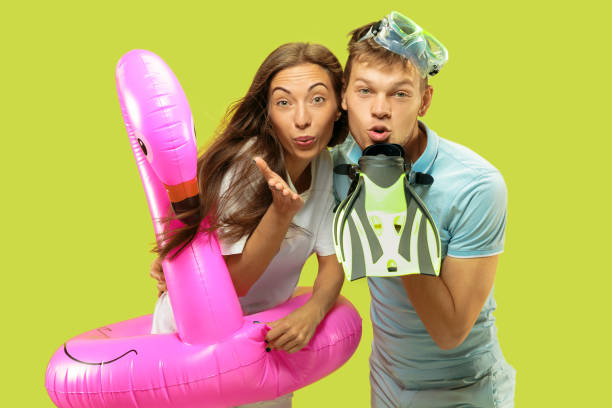 istock Beautiful couple isolated on green studio background 1150660645