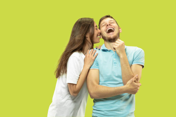 istock Beautiful couple isolated on green studio background 1150660665