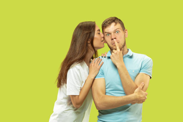 istock Beautiful couple isolated on green studio background 1150660673