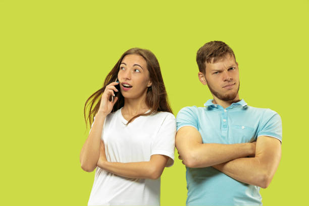 istock Beautiful couple isolated on green studio background 1150660674