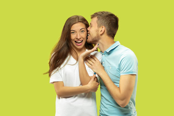 istock Beautiful couple isolated on green studio background 1150660676