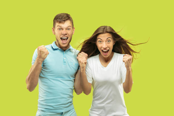 istock Beautiful couple isolated on green studio background 1150660690