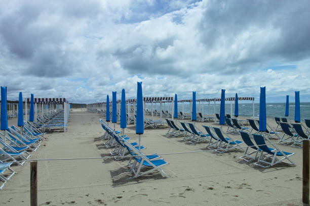 picturesque view on italian sandy beach marina di vecchiano nearby pisa, tuscany  italy - marina di pisa imagens e fotografias de stock