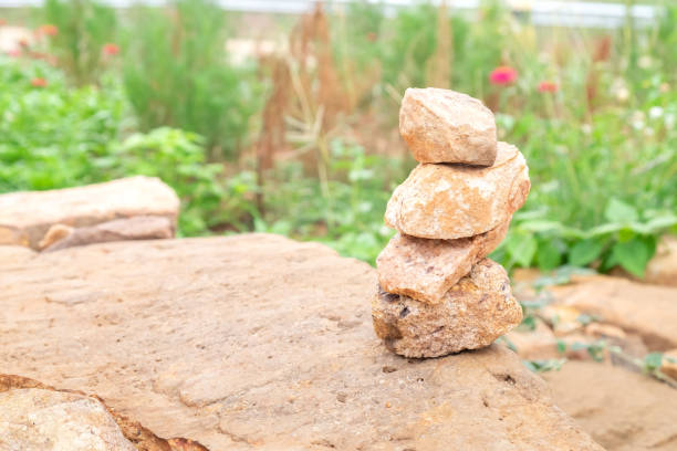 stone stack on the rock sheet in the garden. for nature background. - stacking stone rock full imagens e fotografias de stock