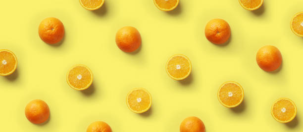 istock Fruit pattern of fresh orange slices on yellow background. Copy Space. Pop art design, creative summer concept. Top view 1150661555