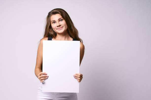 istock Girl with poster. White background. Template 1150664149