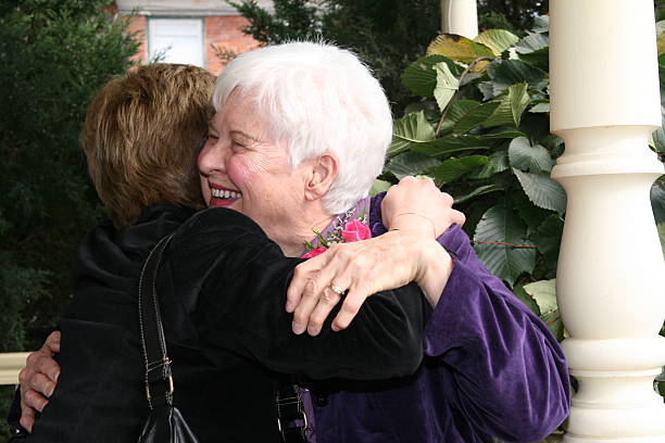 Hug for Senior Woman stock photo