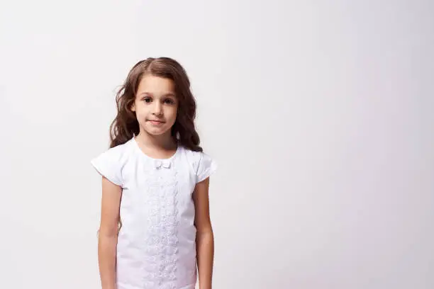 Little girl. Beautiful portrait. White background.