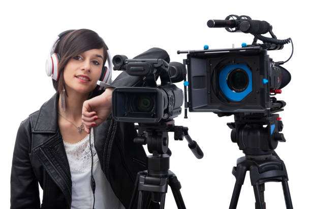 istock smiling young woman with professional video camera, dslr, on white 1150669419