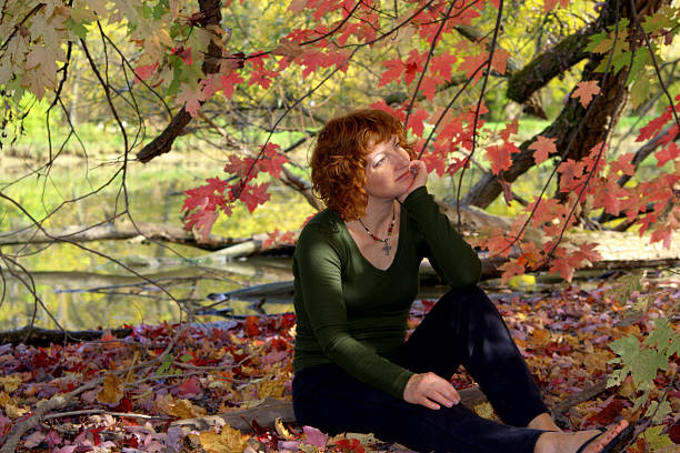 Autumn Reflecting Woman stock photo