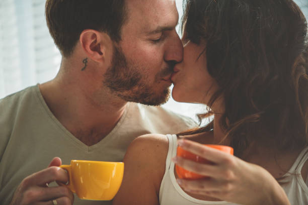 Men toasting coffee cup together