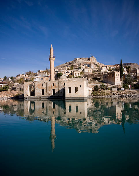 Mosque Mosque in Old Halfeti and its reflection halfeti stock pictures, royalty-free photos & images